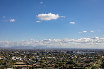 Mountains over desert city phoenix arizona cumulus clouds in the background