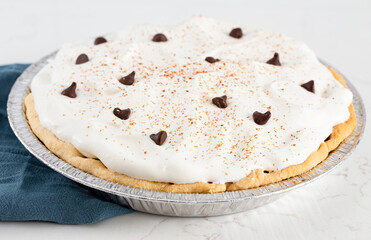 Chocolate Cream Pie Topped with Chocolate Chips and Cocoa on Cream