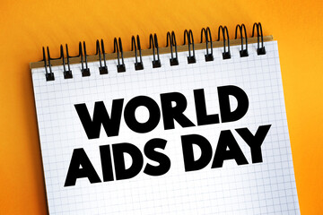 World Aids Day text on notepad, concept background