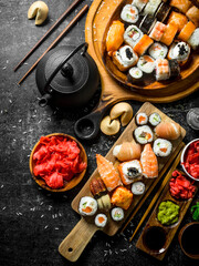An assortment of different types of sushi and rolls.