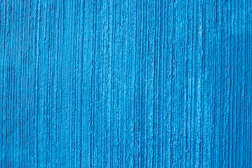 Texture of a plastered wall painted in blue. Concept background.