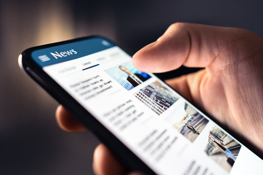 News feed in phone. Watching and reading latest online articles and headlines from smartphone newspaper mobile app. Daily digital information portal and publication. Media and press on internet.