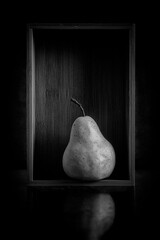 Isolated Pear in Bamboo Box presented in Black and White