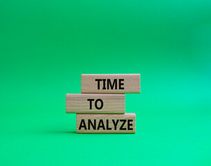 Time to Analyze symbol. Concept word Time to Analyze on wooden blocks. Beautiful green background. Business and Time to Analyze concept. Copy space