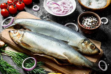 Salted herring with onions, tomatoes, dill and spices.
