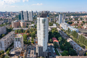 Aerial photography, construction of new high-rise residential complexes among the low buildings of the old city area.