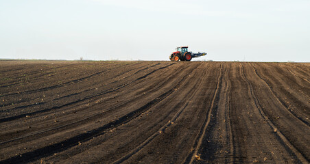 Farmer preparing his field in a tractor