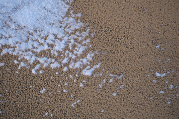 Natural texture of sand. Abstract drawings in the sand