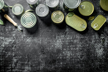 Assortment of tin cans with canned food.