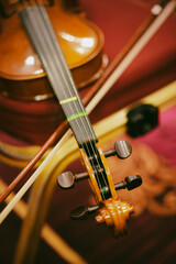 Fototapeta premium Violin on a black chair