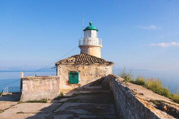 View of Old Venetian Fortress of Corfu, Palaio Frourio, Kerkyra old town, Greece, Ionian sea islands, with the lighthouse, Clock tower, st. George church and the city, a blue sky summer sunny day