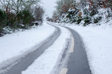 snow covered road, winter transportation concept