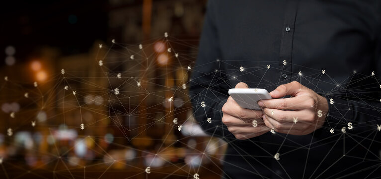 A businessman works in the foreign exchange market on the Interne .