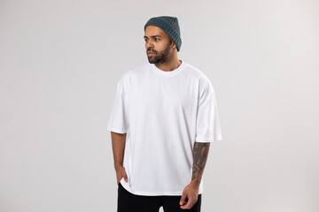 African american man in a hat and white t-shirt.