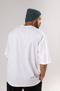 African american man in a hat and white t-shirt.