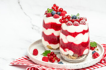 Cranachan raspberry dessert in jar on a light background. Long banner format