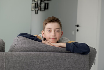 Portrait of Happy Adorable Baby Boy on the Bed in his Room.