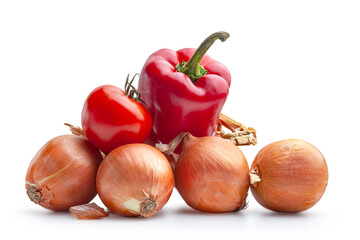 Vegetables isolated on white. Lots of ripe onion, tomato and pepper on a white background