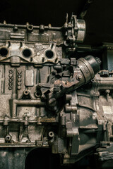 Close up detail of a car engine in a mechanic shop for repair