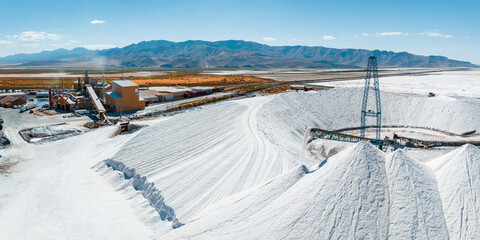 Salt Lake City, Utah landscape with desert salt mining factory at lake Bonneville with piles of...