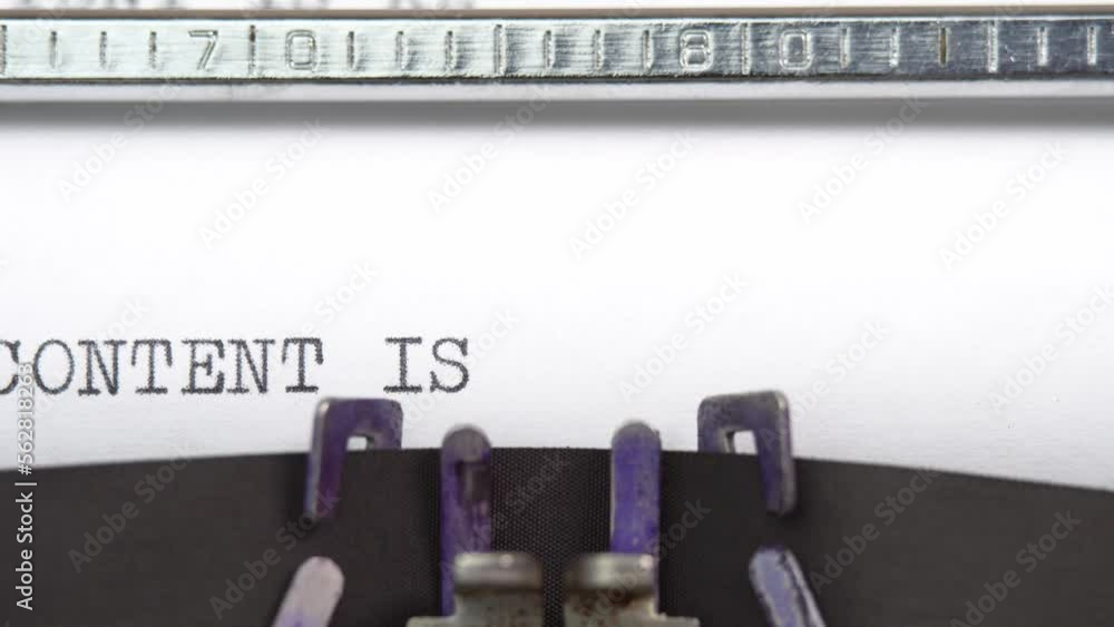 Aufkleber content is key phrase close up being typing and centered on a sheet of paper on old vintage typewrit