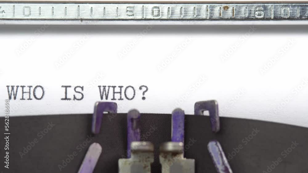 Aufkleber who is who phrase close up being typing and centered on a sheet of paper on old vintage typewriter m