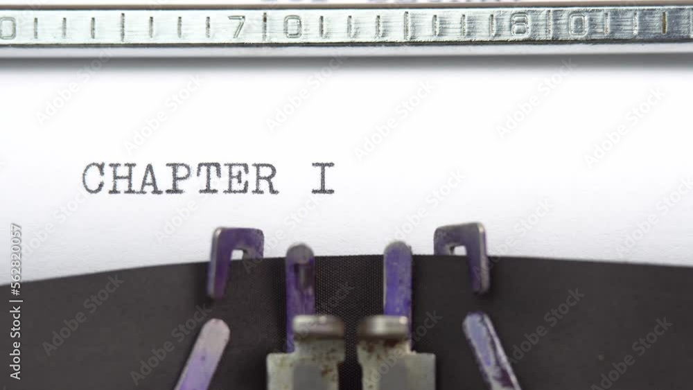 Poster chapter one phrase closeup being typing and centered on a sheet of paper on old vintage typewriter m