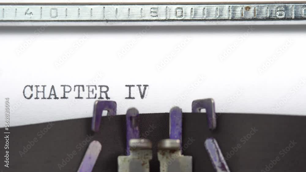 Poster chapter four phrase closeup being typing and centered on a sheet of paper on old vintage typewriter 