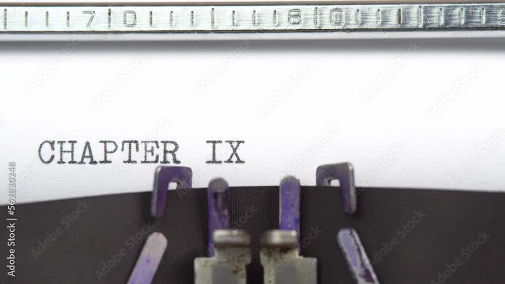 Aufkleber chapter nine phrase closeup being typing and centered on a sheet of paper on old vintage typewriter 