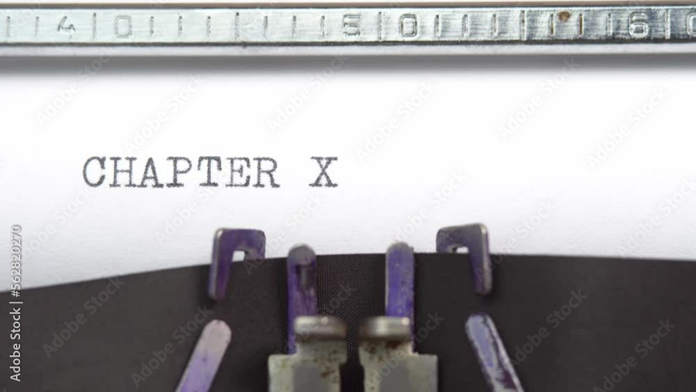 Aufkleber chapter ten phrase closeup being typing and centered on a sheet of paper on old vintage typewriter m