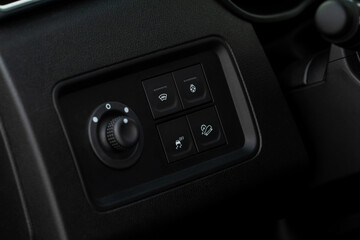 Windshield defrost button. Modern car interior details. Windshield heating close up view.