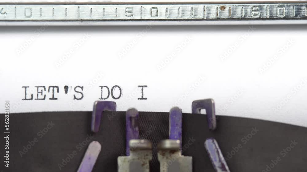 Aufkleber lets do it phrase closeup being typing and centered on a sheet of paper on old vintage typewriter me
