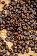 Roasted Coffee Beans on Burlap Sack Background