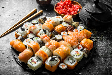 Fresh sushi rolls with vegetables, shrimp and salmon.