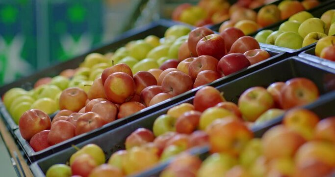 ripe apples on counter in food market, closeup view, buying organic fruits, 4K, Prores