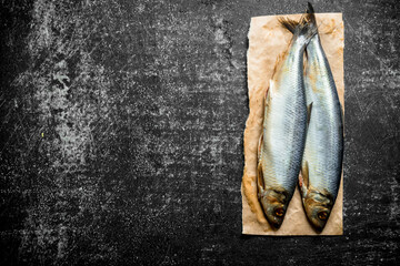 Salted herring on paper.