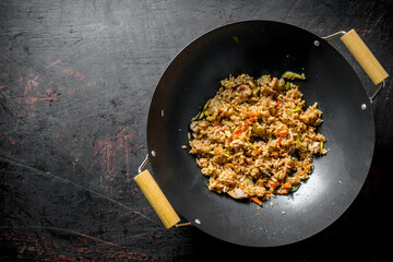 Chinese wok. Rice with beef and vegetables.
