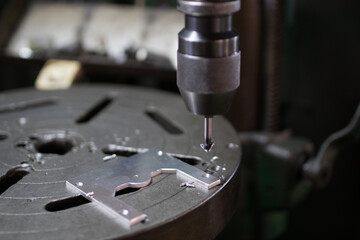Part machining with drilling machine
