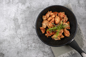 Greek gyros in a frying pan on a gray background