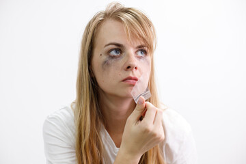 portrait of a woman tearing tape from her mouth