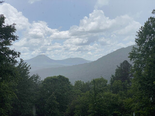 A view of a mountain range in the rain