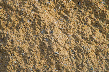 Sandstone texture. Yellow stone background