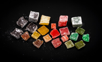 Assorted delicious Colorful Turkish Delights on dark background