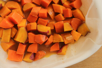 diced sweet potato baked in the oven on a baking sheet