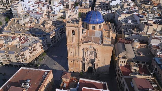 Discover the Beauty of Costa Blanca's Baroque Monument: Aerial Drone Footage of the Basilica Santa Maria in Elche, Spain and its Sculptures. Cinematic Revealing shot