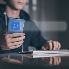 Boy use computer and smartphone for searching online. Search engine bar. Browsing Internet concept.