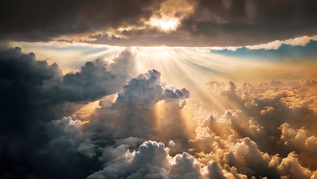 An aerial shot above beautiful sunset clouds with sun shining through fog, detailed picturesque view, camera moving into amazing cloudscape with beautiful light rays.