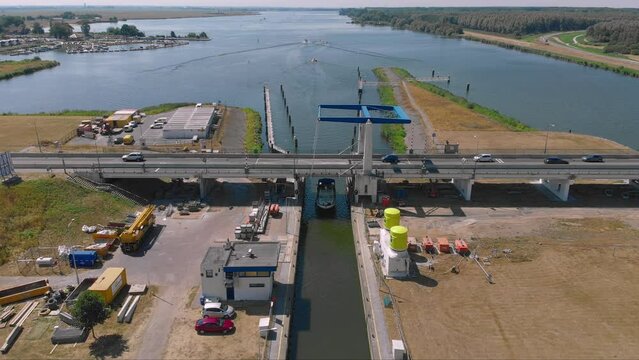 Aerial drone shot of a waterway with a boat in Zeewolde, The Netherlands