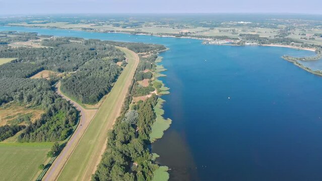 Aerial high altitude drone shot of a lake and beach in Zeewolde, The Netherlands