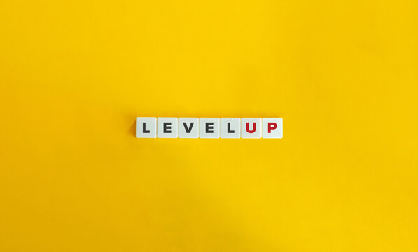 Level Up Banner. Letter Tiles On Yellow Background. Minimal Aesthetics.